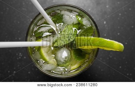 Closeup Glass Of Unalcohol Mohito Cocktail With Lime And Mint Decorated With Slice Of Lime And With 