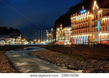 Rosa Khutor, Russia - April 22, 2018: Night View On Tulip Inn Hotel From The Opposite Side Of The Ri