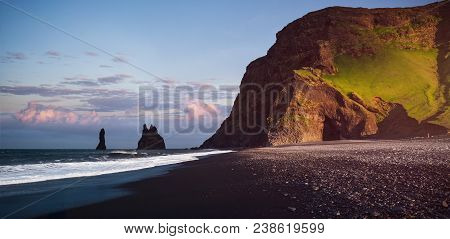 Famous Reynisdrangar Rock Formations At Black Reynisfjara Beach. Coast Of The Atlantic Ocean Near Vi