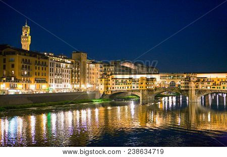 Italy,tuscany,florence,night View Of The Houses Of The Lungarno And The Ponte Vecchio Bridge