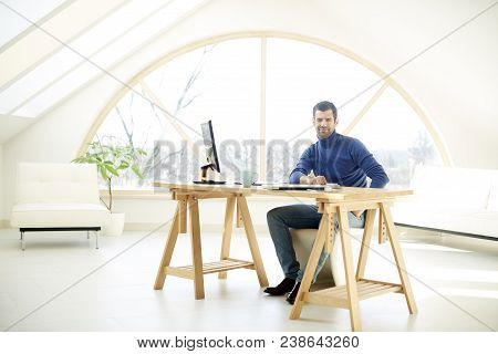 Smiling Young Businessman At The Office