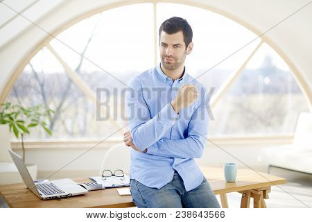 Smiling Young Businessman In The Office