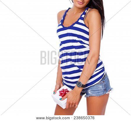 Portrait Of Sexy Brunet Posing In Studio With A Present