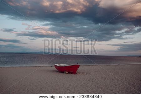 Fishermens Boat At Seacoast, On Sand At Sunset With Horisont Sea On Background. Background Of Sea Wi