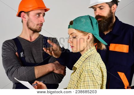 Recruitment Concept. Brigade Of Workers, Builders In Helmets, Repairers And Lady Discussing Contract