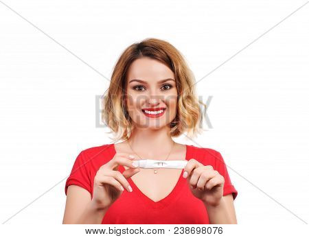 Happy Woman Showing A Positive Pregnancy Test