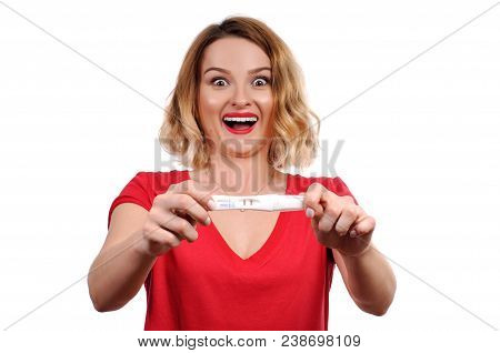 Shocked  Happy Woman Showing A Positive Pregnancy Test.