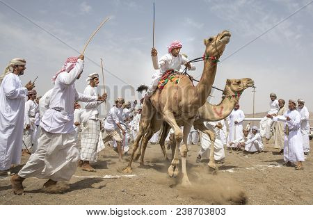 Men On Camels At The Start Of A Race