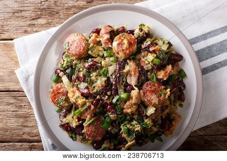 Brazilian Food: Feijao Tropeiro With Beans, Sausage And Bacon Close-up On A Plate. Horizontal Top Vi