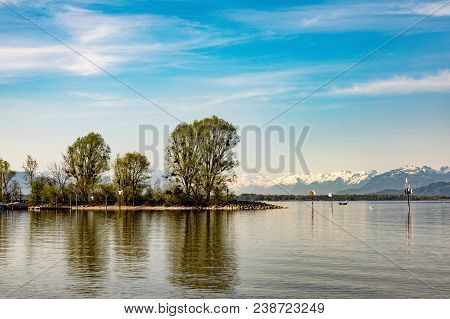 Lake Constance, In The Background Snowy Peaks Of The Alps. Germany