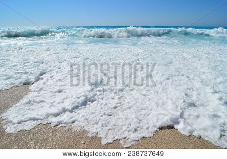 Powerful, Big Vawes And Sea Foam In Foreground, White And Bluue, Colours Of Greek Flag, Famous Beach