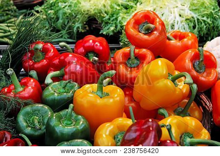 Fresh Green, Red And Yellow Bell Peppers Paprika On A Market.