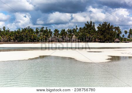 Tropical Beach After Low Tide. Texture Of Sand On The Beach, Mombasa. Sand Waves On The Beach.