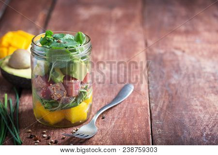Asian Poke Salad With Tuna, Avocado And Vegetables On A Rustic Background, Copy Space For Text, Vege