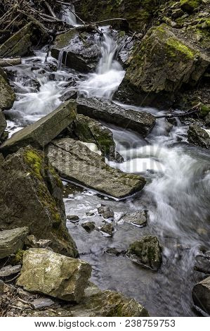 Water Rushing Down Strem Through And Around Rocks
