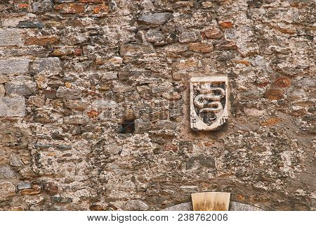 Ancient Coat Of Arms Of Swiss City Of Bellinzona Depicting An Erect Serpent On The Old Town Wall