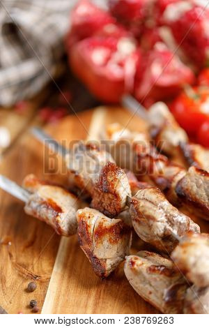 Shish Kebabs From Pork On Skewers Close-up. Juicy Appetizing Meat Cooked On An Open Fire. Rustic.