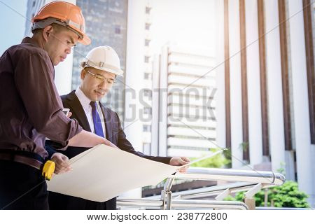 Two Asian Business And Engineer Man Has Planning And Working For Design Buiding And City.