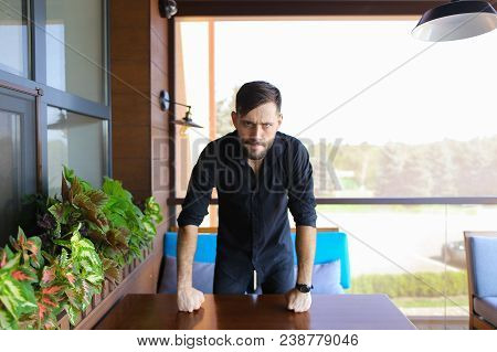 American Businessman Standing At Office And Wearing Black Shirt. Concept Of Responsibility And Succe