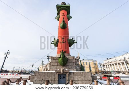 View Of Rostral Column On Birzhevaya Ploschad Square In Saint Petersburg City In March