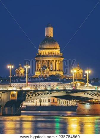 Blagoveschensky Or Annunciation Bridge And Saint Isaac Cathedral At Night. Saint-petersburg, Russia