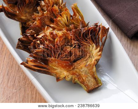 Fried Sliced Artichokes	 - Alcachofas Fritas

Artichoke Slices Deep Fried In Olive Oil. Tasty Vegan 