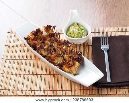 Fried Sliced Artichokes	 - Alcachofas Fritas

Artichoke Slices Deep Fried In Olive Oil. Tasty Vegan 