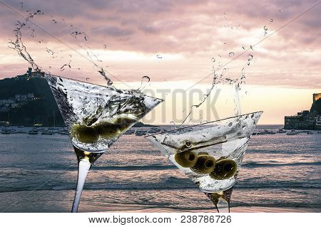 Cocktails With Splashining Martini On A Sunset Beach