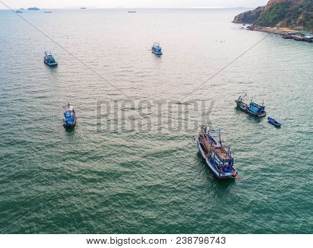 Fishing Boat Floating In The Sea. The Beautiful Bright Blue Water In A Clear Day.aerial View.top Vie