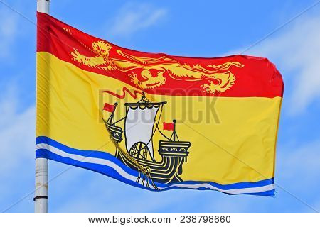 Flag Of New Brunswick On Blue Sky. Photo Taken In Saint John In New Brunswick, Canada.
