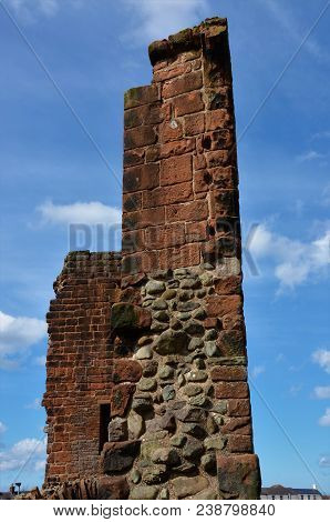 A View Of The Ruins Of The Medieval Red Sandstone Castle In Penrith, Cumbria.