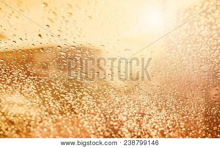 Droplets Of Rain On Car Wind Shield Reflection With Glow Sunlight In Morning Rainyday
