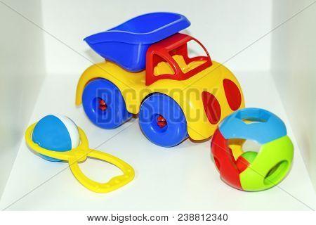 Children's Toys: Rattle, Teetotal And Plastic Truck