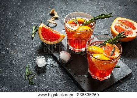 Grapefruit And Rosemary Gin Cocktail, Refreshing Drink With Ice.