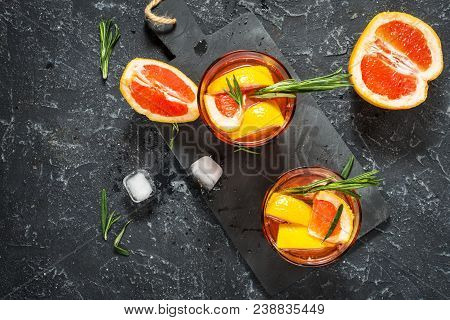Grapefruit And Rosemary Gin Cocktail, Refreshing Drink With Ice. Top