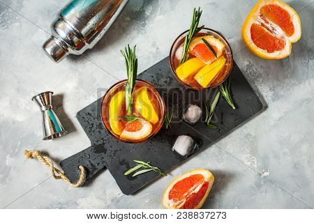 Grapefruit And Rosemary Gin Cocktail, Refreshing Drink With Ice. Top