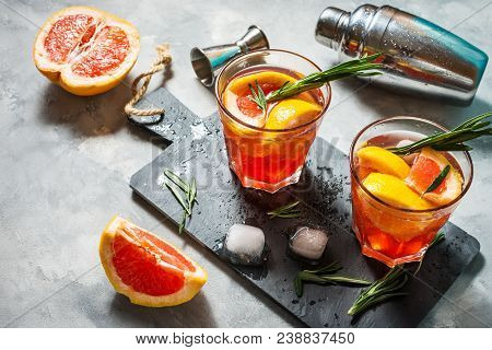 Grapefruit And Rosemary Gin Cocktail, Refreshing Drink With Ice.