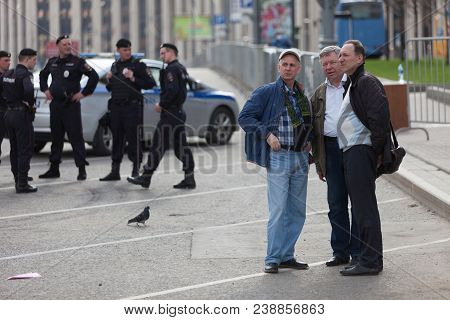 Moscow, Russia - April 30, 2018: People Stand In Front Of The Police And Rosgvardia In Cordon After 