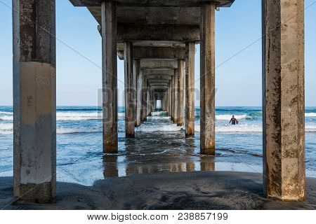 Beneath A Symmetrical Concrete Pier In La Jolla, California.