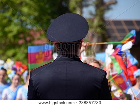 Slavyansk-on-kuban, Russia - May 1, 2018: A Policeman, Who Cries Out The Tranquility Of Citizens At 