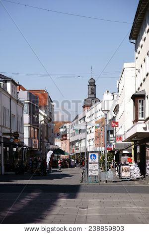 Ruesselsheim, Germany - April 11: Pedestrians And Passers-by Go Shopping In The Market Street On Apr