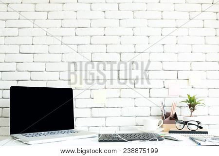 Close Up Gedgets On Workplace White Desk With Laptop And Smartphone