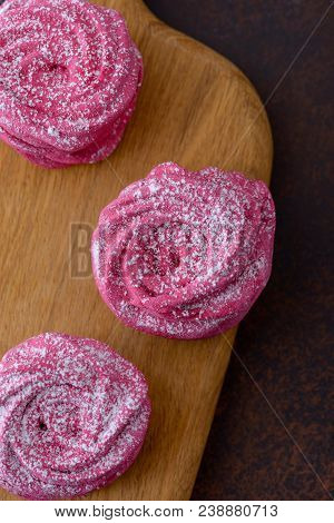 Close-up Sweet Meringues Cookies On Oak Board