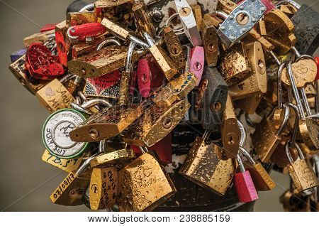 Paris, Northern France - July 10, 2017. Padlocks Fastened To Each Other Celebrating Love On Pole Ove