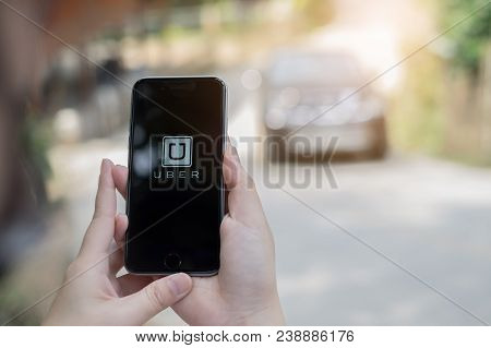 Chiang Mai,thailand - March 01, 2018 : A Uber Driver Hand Holding Uber App Showing On Iphone 6S On R