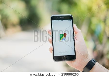Chiang Mai, Thailand - Mar 01, 2018: A Man Hand Holding Screen Shot Of Google Maps App Showing On Ip