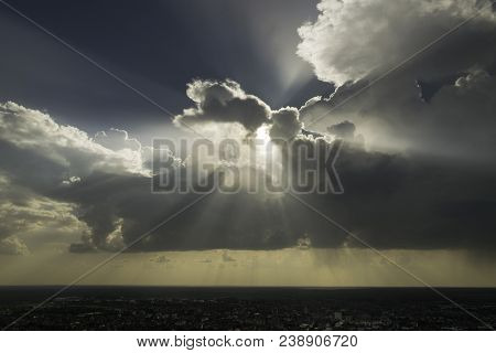 Beautiful Landscape With Sun Rays Through Clouds. Landscape With Clouds Over Small Town. Sun Rays Th