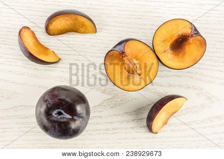 Red Blue Plums Set Table Top Isolated On Grey Wood Background One Whole Two Section Halves Three Sli