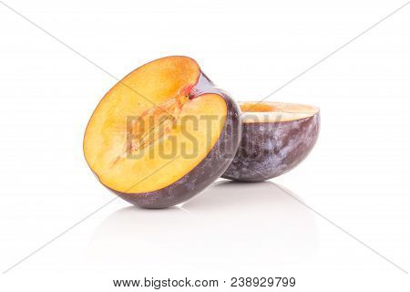 Sliced Red Blue Plum Isolated On White Background One Cut In Two Halves
