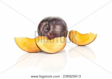 One Red Blue Plum And Three Slices Isolated On White Background